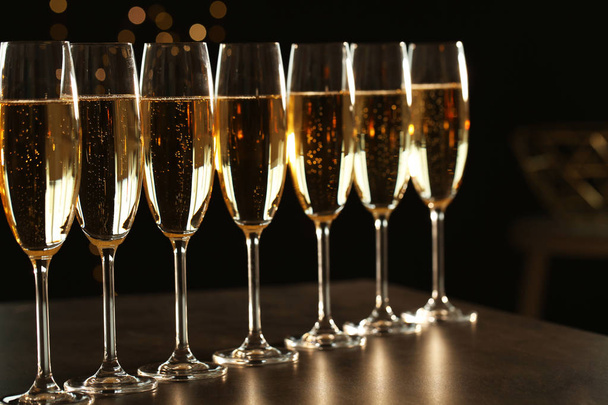 Many glasses of champagne on table. Space for text - Foto, Imagen