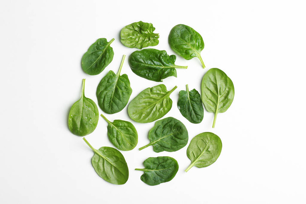 Fresh leaves of spinach isolated on white, top view - Foto, Bild