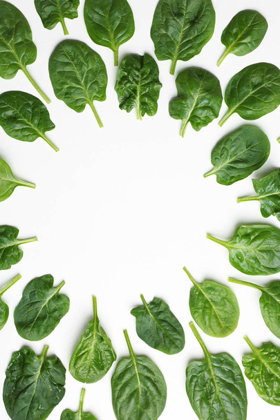 Frame made of spinach leaves on white background, top view. Space for text - Fotoğraf, Görsel
