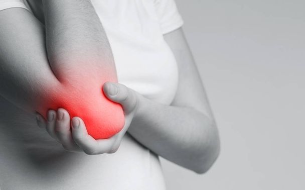 Bone pain or muscle pain around elbow - Photo, Image