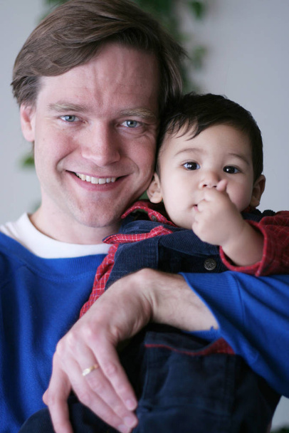 Father holding his baby boy - Фото, зображення