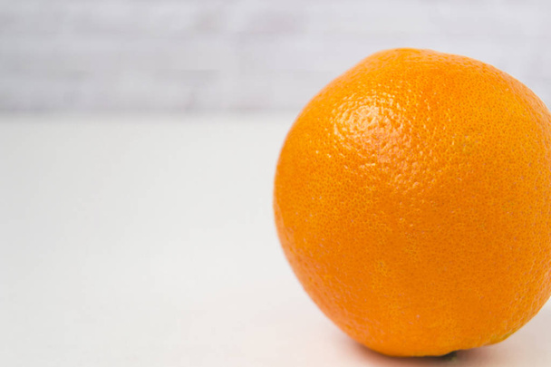 Isolated orange orange against a white background - Foto, afbeelding