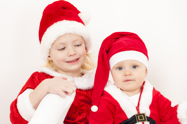 Noel Baba olarak iki küçük kız - Fotoğraf, Görsel