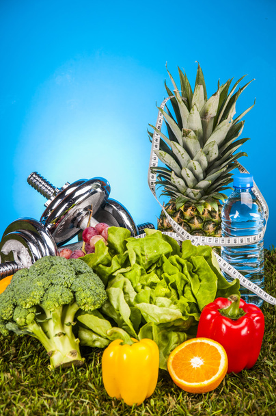Fitness theme with fruits, bright background - Photo, Image