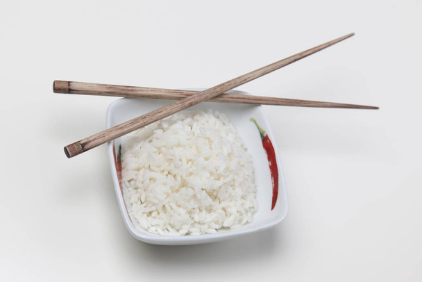 Bowl of white rice isolated on white - Φωτογραφία, εικόνα