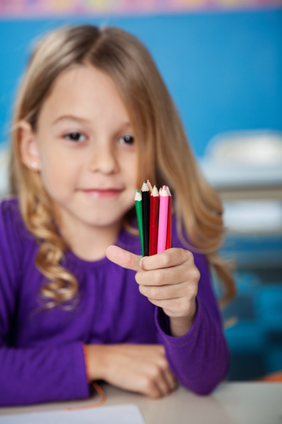 Girl Holding Color Pencils In Kindergarten - Photo, image