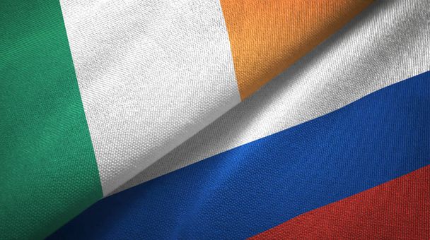 Írország és Oroszország két zászló Textil szövet, szövet textúra - Fotó, kép