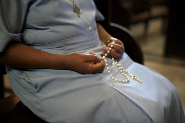 Women and religion, catholic sister praying in church, holding c - Photo, Image
