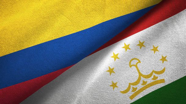 Колумбія і Таджикистан два прапори текстильної тканини, текстура тканини - Фото, зображення