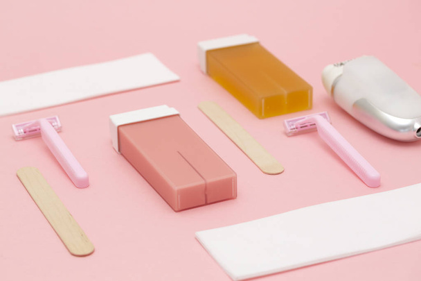 Set for epilation on pink background. The concept of hair removal. Flat lay.  - Fotó, kép