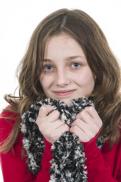 Young girl posing with scarf held to chin - Fotoğraf, Görsel