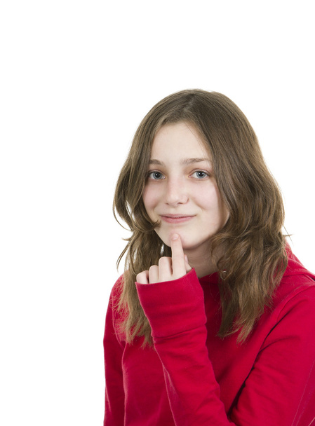 νεαρό κορίτσι με το δάχτυλο στο πηγούνι - Φωτογραφία, εικόνα