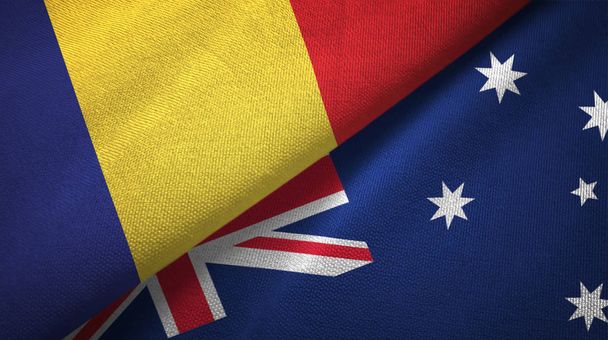 Roemenië en Australië twee vlaggen textiel doek, weefsel textuur  - Foto, afbeelding