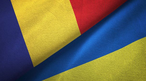 Rumunsko a Ukrajina dvě vlajky textilní tkaniny, textura textilií - Fotografie, Obrázek
