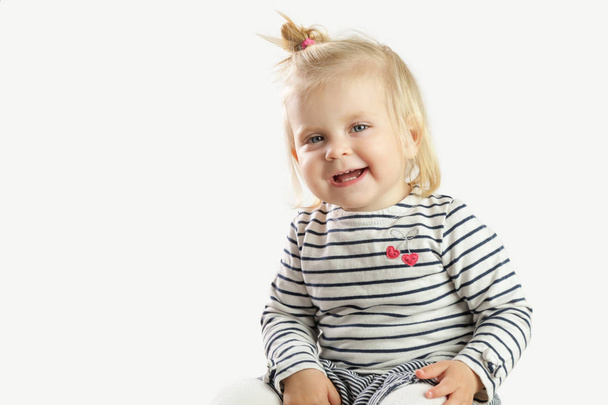 Studio portrait of adorable blonde smiling baby girl  - Zdjęcie, obraz