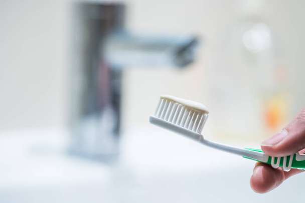 Brushing the teeth: Toothbrush in the bathroom - Fotografie, Obrázek