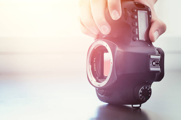 Photographer is using a professional camera, open sensor and sun - Valokuva, kuva