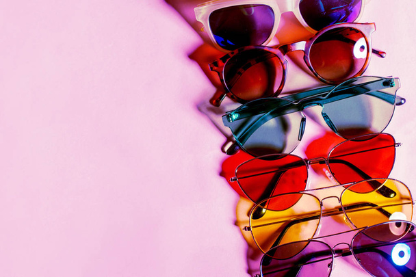  Variety of sunglasses over colorful background - Фото, изображение