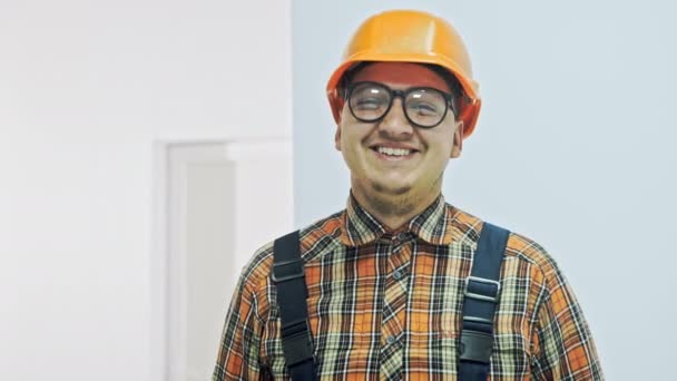 Portrait of a happy worker. Isolated on white - Footage, Video