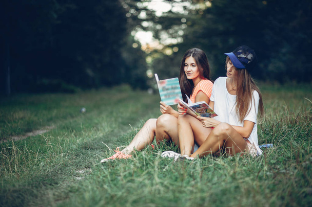 Two pretty girls in a summer park - Photo, image