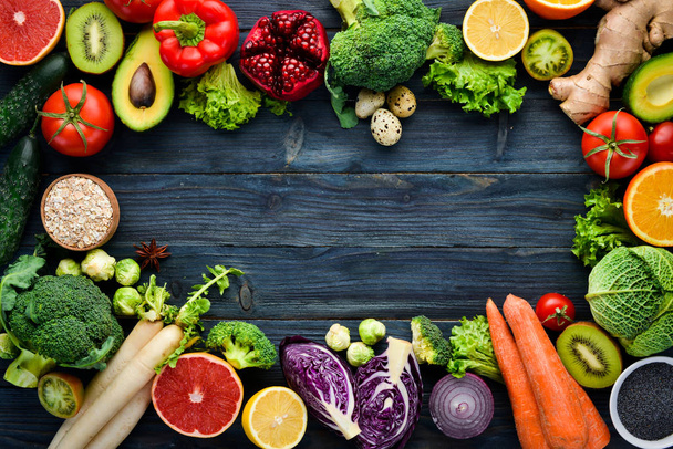 Healthy organic food on a blue wooden background. Vegetables and fruits. Top view. Free copy space. - Φωτογραφία, εικόνα