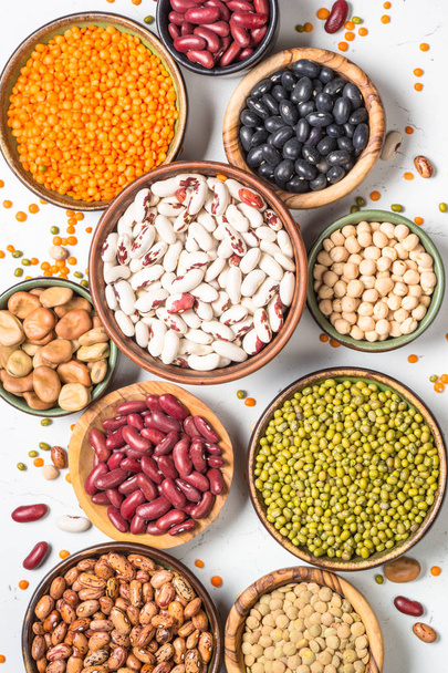 Legumes, lentils, chikpea and beans assortment on white. - Foto, imagen