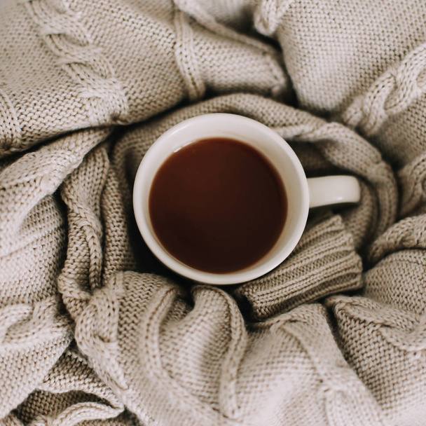 Wool sweater, knitted plaid and coffee cup. Breakfast in bed. Sweet home. flat lay, still life - Foto, immagini
