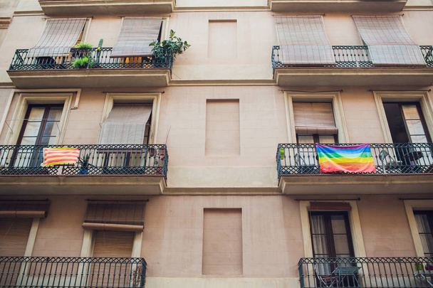Rainbow flags on the balconies of a house in the Chueca district in Madrid, Spain. - Photo, image