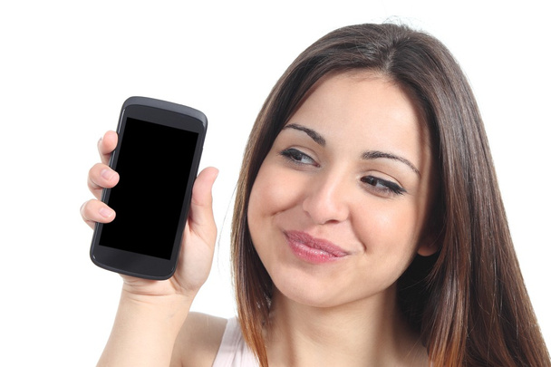 Sweet woman showing a blank mobile phone screen - Фото, изображение