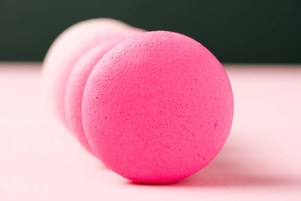 selective focus of sweet colorful macarons on pink surface - Valokuva, kuva
