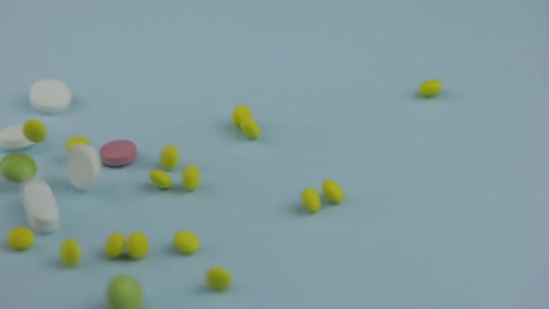 Medical pills falling down. Medicine concept. Coloured capsules, pills, tablets - Filmagem, Vídeo