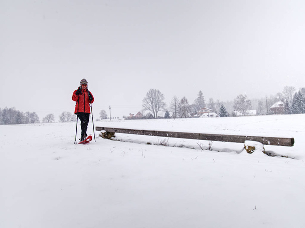 Single snow walker or cross skier sports woman and gray clouds i - Photo, Image