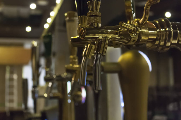 close-up of golden beer taps in a nightclub / bar / pub - Photo, Image