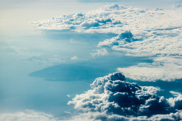 Top view of white clouds above the water - Photo, Image
