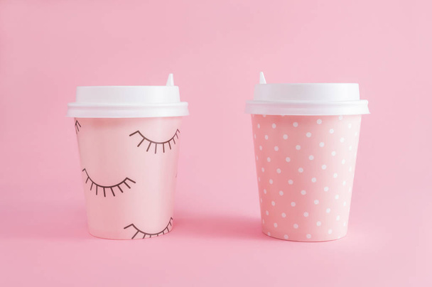 Two glass of coffee take-away on a pink pastel background. Coffee time. With copy space. - Фото, зображення