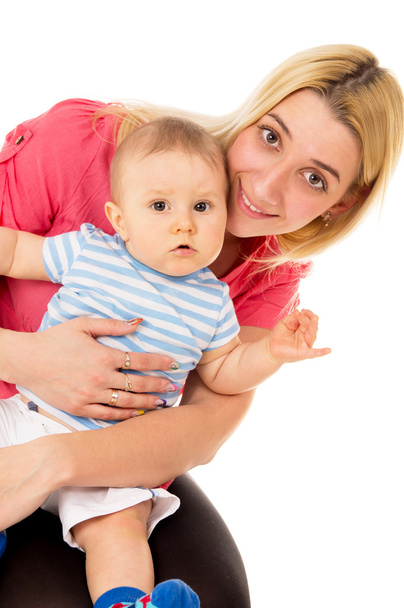 a happy mother holding a baby - Fotó, kép