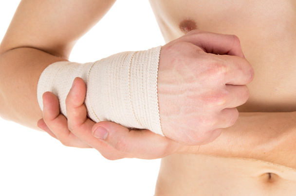 bandaging the hand with an elastic bandage - Photo, Image