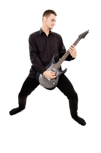 guy in black clothes plays the guitar - Фото, зображення