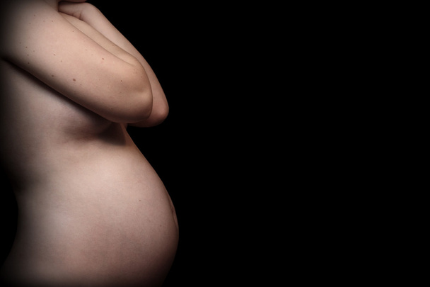 Pregnant woman's belly - Foto, imagen