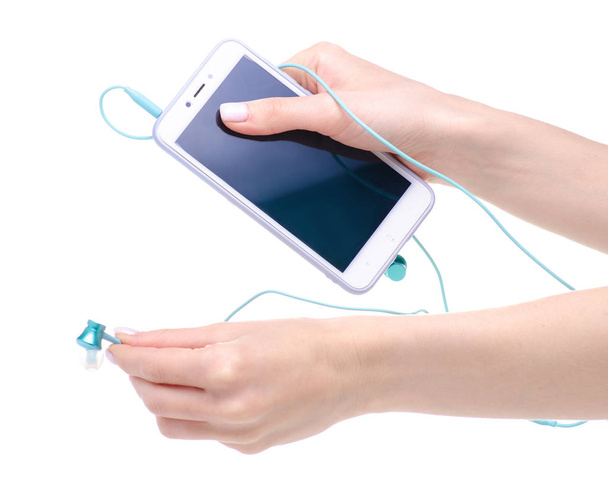 Blue headphones with smartphone in hand - Фото, изображение