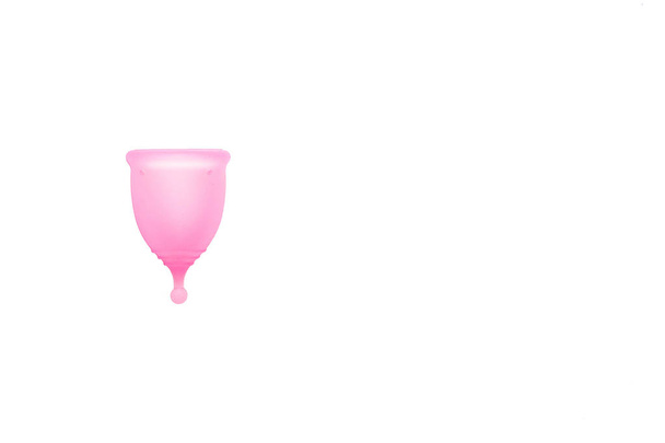 Menstrual cup isolated on background. Alternative feminine hygiene product during the period. Women health concept - Foto, imagen