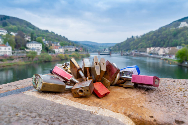  Lovers locks fastened to old bridge  - Photo, Image
