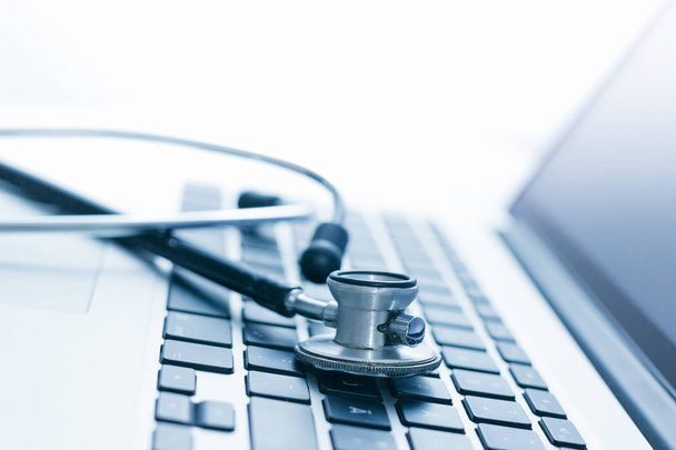 closeup view of stethoscope with laptop keyboard - Photo, Image