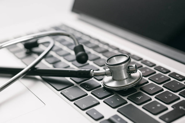 Stethoscope with laptop keyboard, medical concept. - Photo, Image