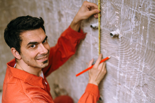 Repairman using measuring tape - Fotoğraf, Görsel