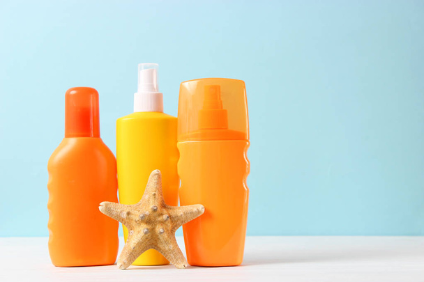 Set of different sun creams on a colored background. Cosmetics for sun protection. - Foto, afbeelding