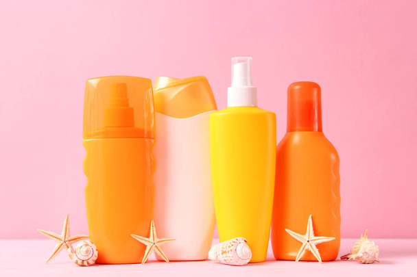 Set of different sun creams on a colored background. Cosmetics for sun protection. - Foto, Imagen