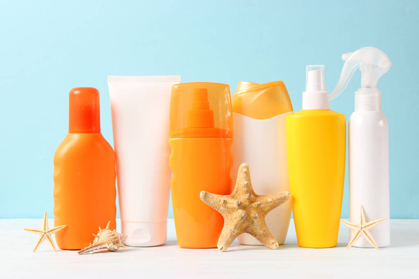 Set of different sun creams on a colored background. Cosmetics for sun protection. - Photo, Image