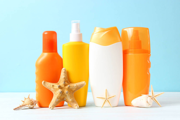 Set of different sun creams on a colored background. Cosmetics for sun protection. - Foto, Imagem