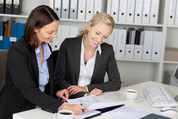Confident Young Businesswomen Sitting At Office Desk - Photo, Image